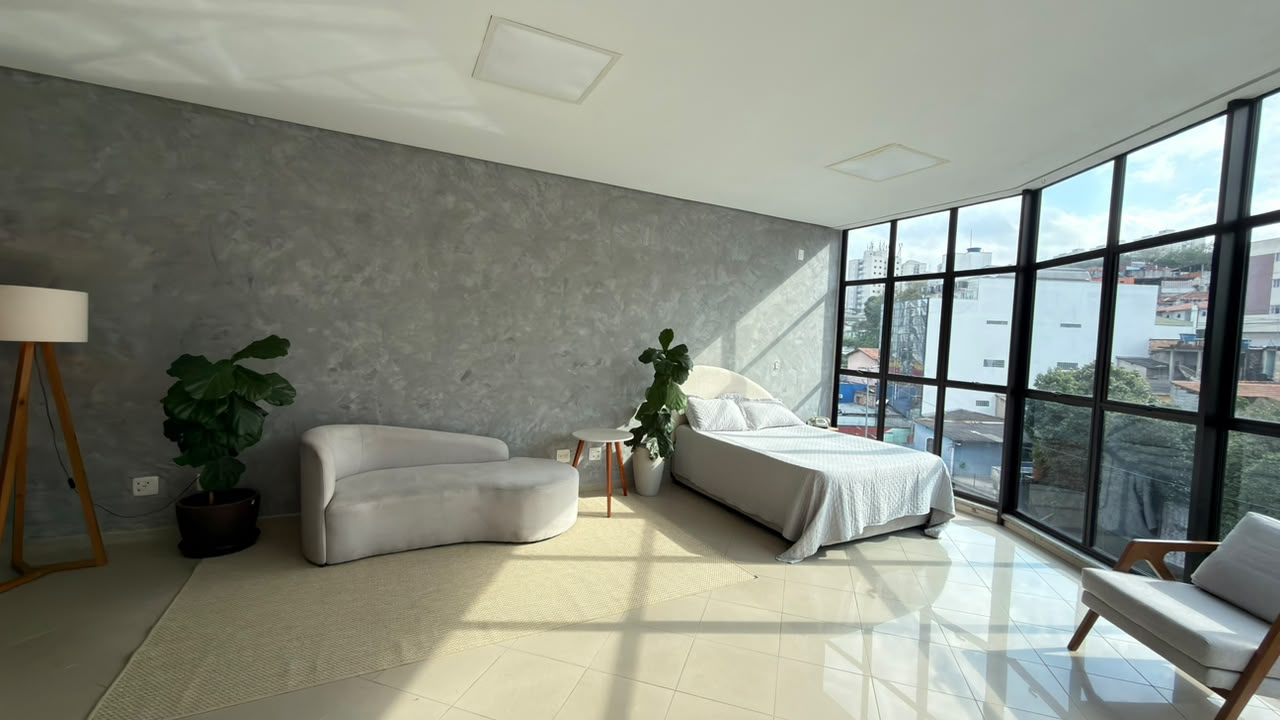 Sala de Produção — ambiente com sofá e cama